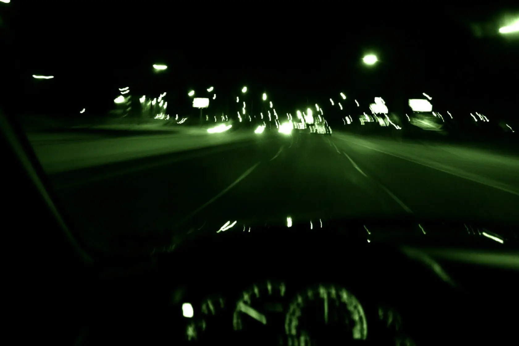 Drowsy Driving Accident Lawyers 1 Blurry green tint image of driving