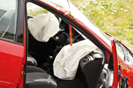 Blog 14 Red vehicle crashed with passenger door open and airbags deployed