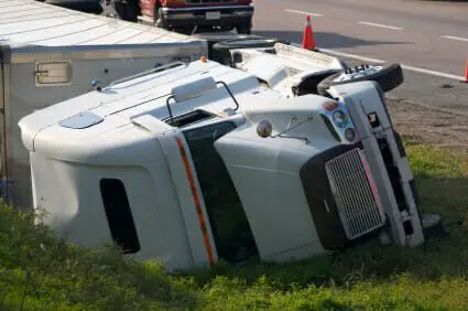 Flipped over on its side 18-wheeler accident