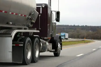 Bicyclist Hit and Killed by 18-Wheeler during Rush Hour 1 Maroon 18-wheeler truck driving past