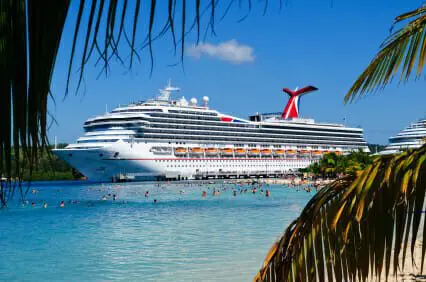 Cruise ship docked at beach paradise