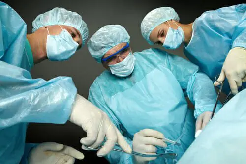 FDA Issues Safety Alert for Zoll LifeVest Wearable Defibrillator 1 Bottom view of three surgeons operating