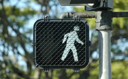 Woman Hospitalized After Hit-and-Run Crash in San Antonio 1 Pedestrian crosswalk signal with walk illuminated