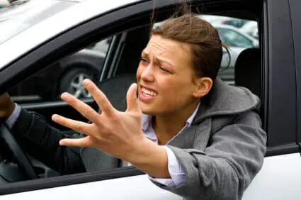 Blog 17 Angry driver frustrated leaning outside of car window
