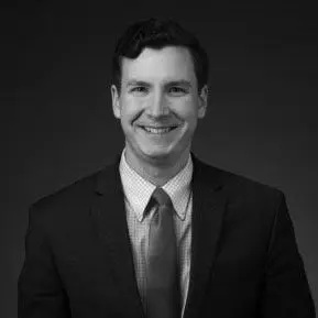 Black and white portrait photo of Thomas J. Henry Attorney Gregory S. Cotton