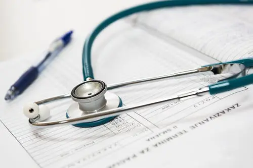 Tips to Stay Healthy Amidst Flu Season and COVID-19 1 Stethoscope on document