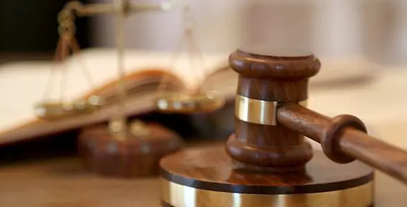 Blog Judge Banging a Gavel in a Courtroom