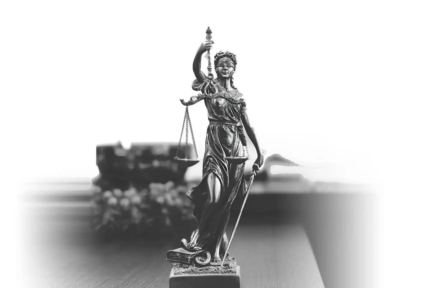 Blog 2 Statue of Themis holding scales of justice in lawyer's office