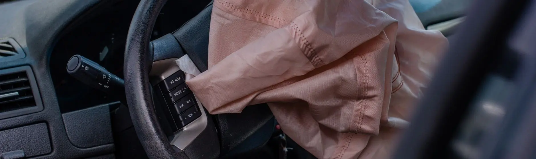 Blog Damaged car with airbags deployed