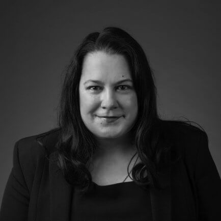 Black and white portrait photo of Thomas J. Henry Attorney Karen K. Villaruel