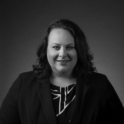 Black and white portrait photo of Thomas J. Henry Attorney Tanya M. Bachand