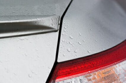 Rain drops on rear bumper of vehicle