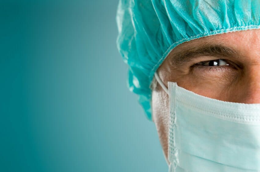male surgeon gazing and looking at camera at hospital