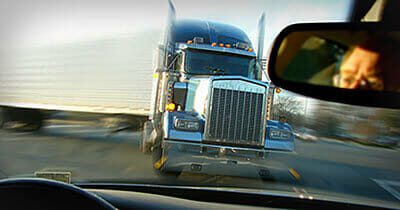 18-wheeler turning into a car